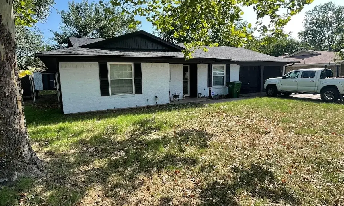 Professional roofing crew working on a residential roof in Miramar Beach